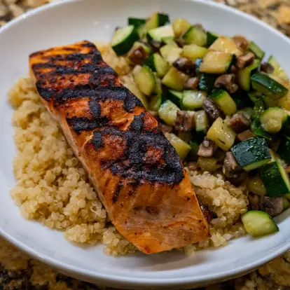Healthy salmon meal with zucchini and mushrooms